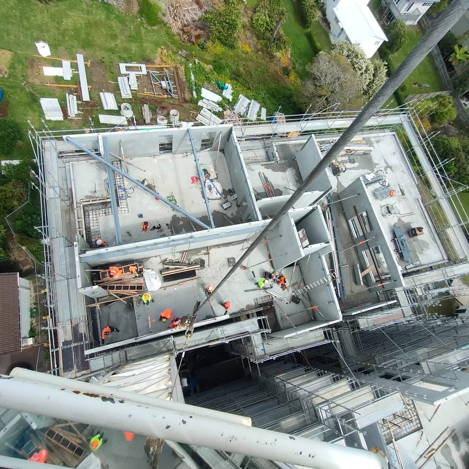 Aerial view of Clyde Services crane operations on an Auckland construction site