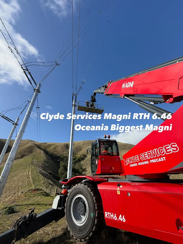Telecommunications tower installation with workers at height