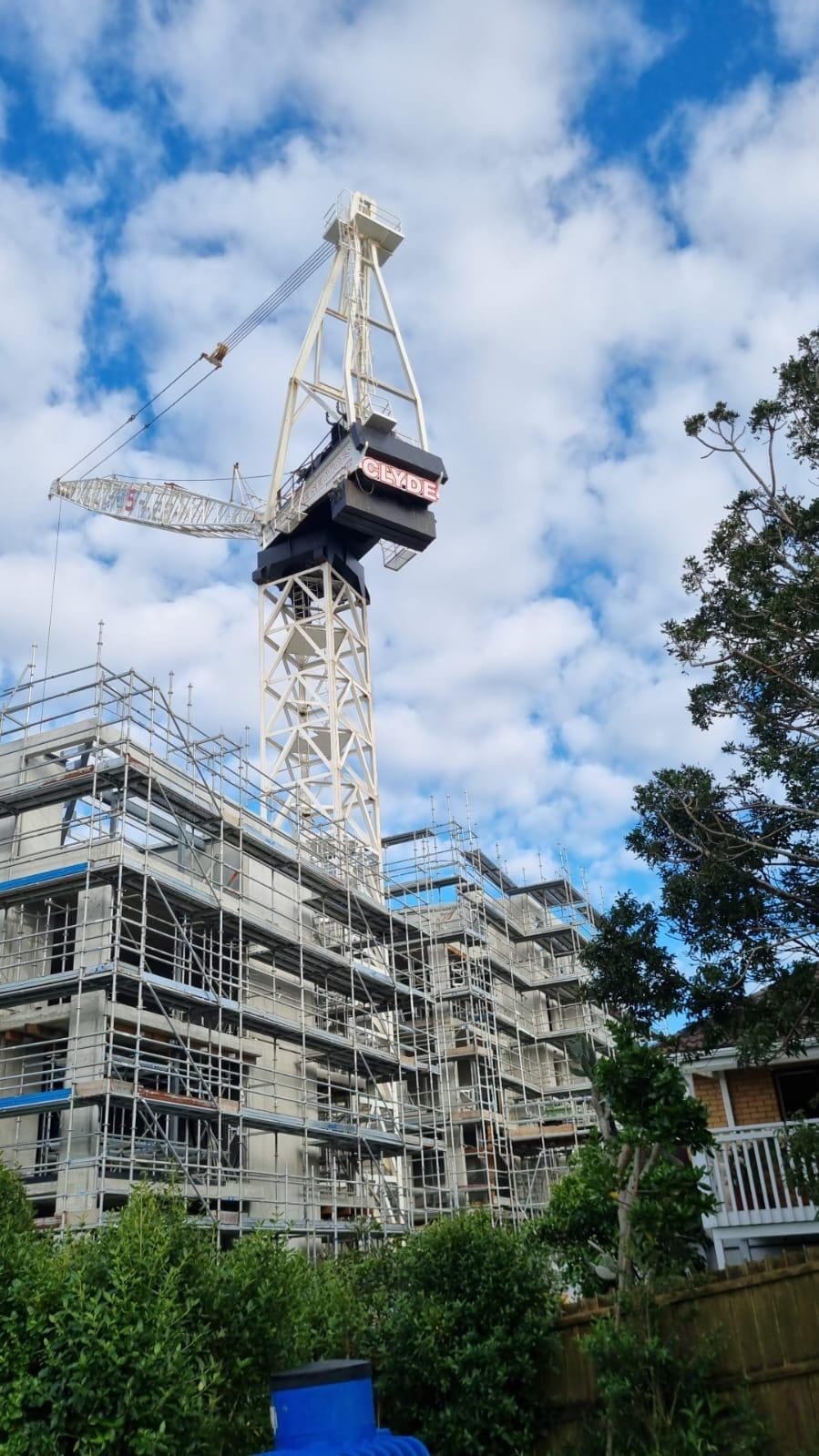 Tower crane on active multi-storey construction site in Auckland